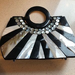Unique clutch made with mother of pearl & buttons!